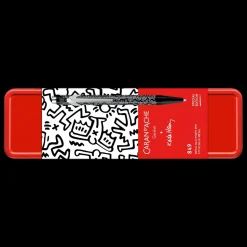 Estuche metálico con bolígrafo Negro Keith Haring Caran d'Ache